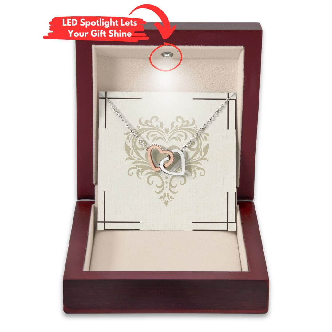 Mahagony-style luxury box featuring an LED light to shine on the pendant and gift message